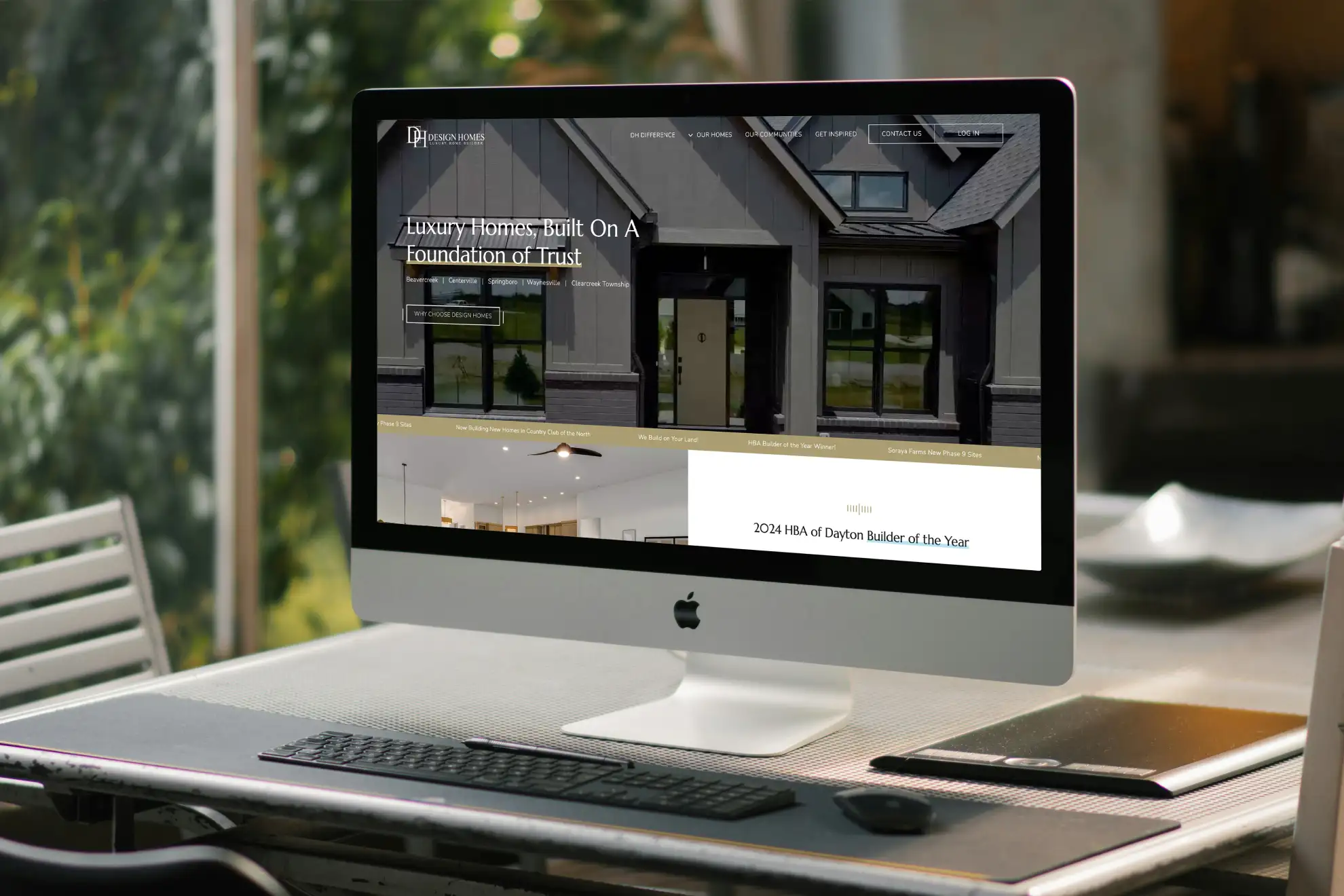 Design Homes Luxury Home Builder website being viewed on a desktop